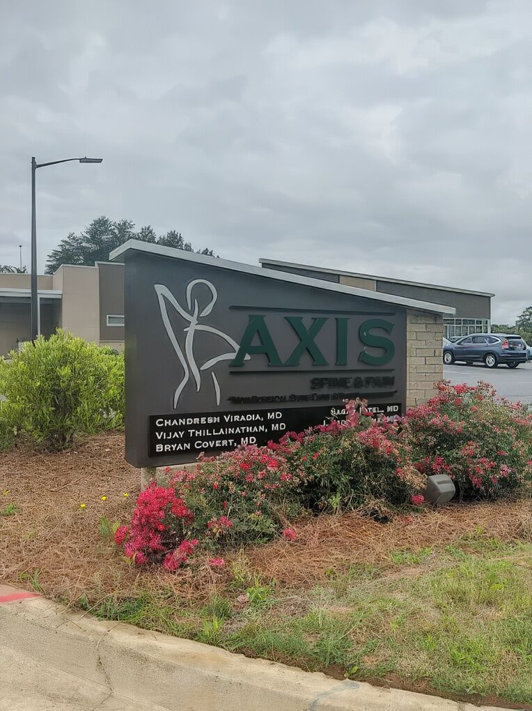 Explore Advanced Non-Surgical Treatments for Back Pain in Warner Robins, GA A healthcare professional performing a minimally invasive procedure, such as an injection for back pain, with a subtle visual touch of Warner Robins or the Georgia state silhouette.