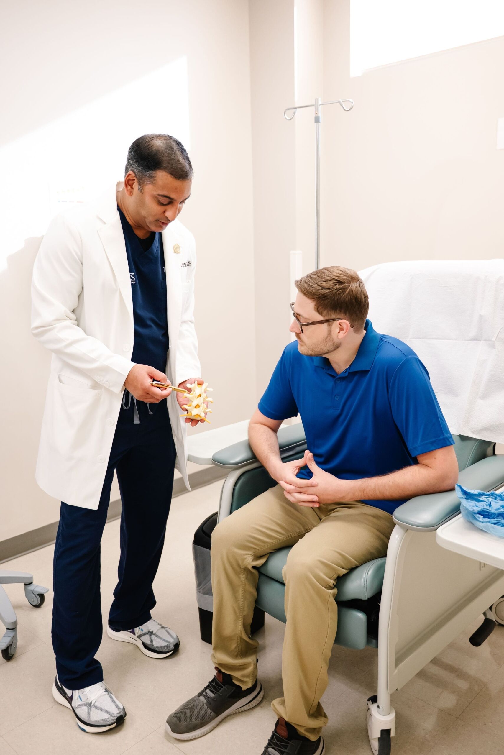 An image of a smiling patient and healthcare provider in a modern clinic setting, emphasizing personalized care and treatment.