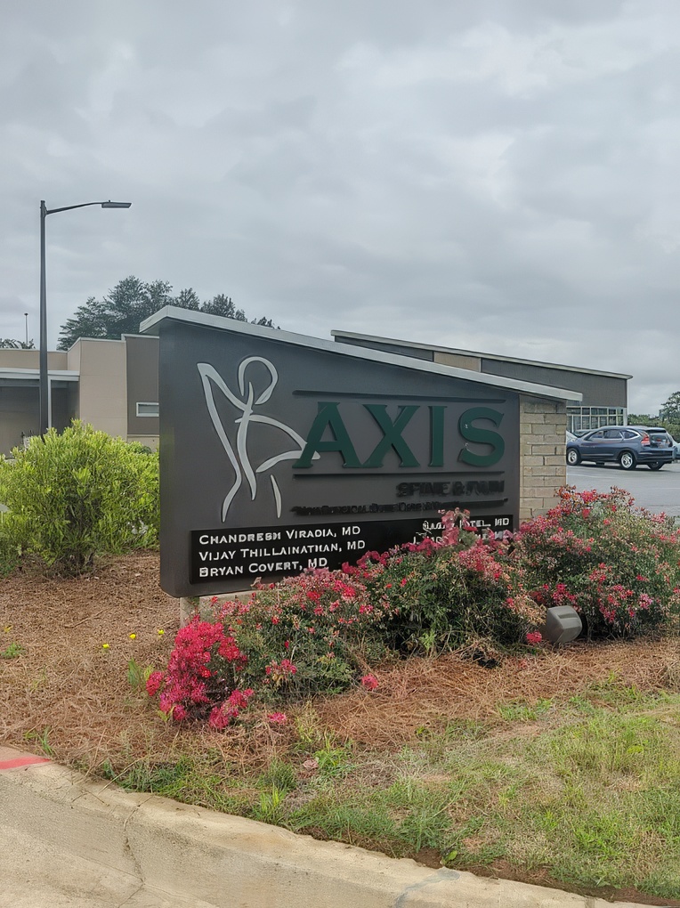 Explore Advanced Non-Surgical Treatments for Back Pain in Warner Robins, GA A healthcare professional performing a minimally invasive procedure, such as an injection for back pain, with a subtle visual touch of Warner Robins or the Georgia state silhouette.