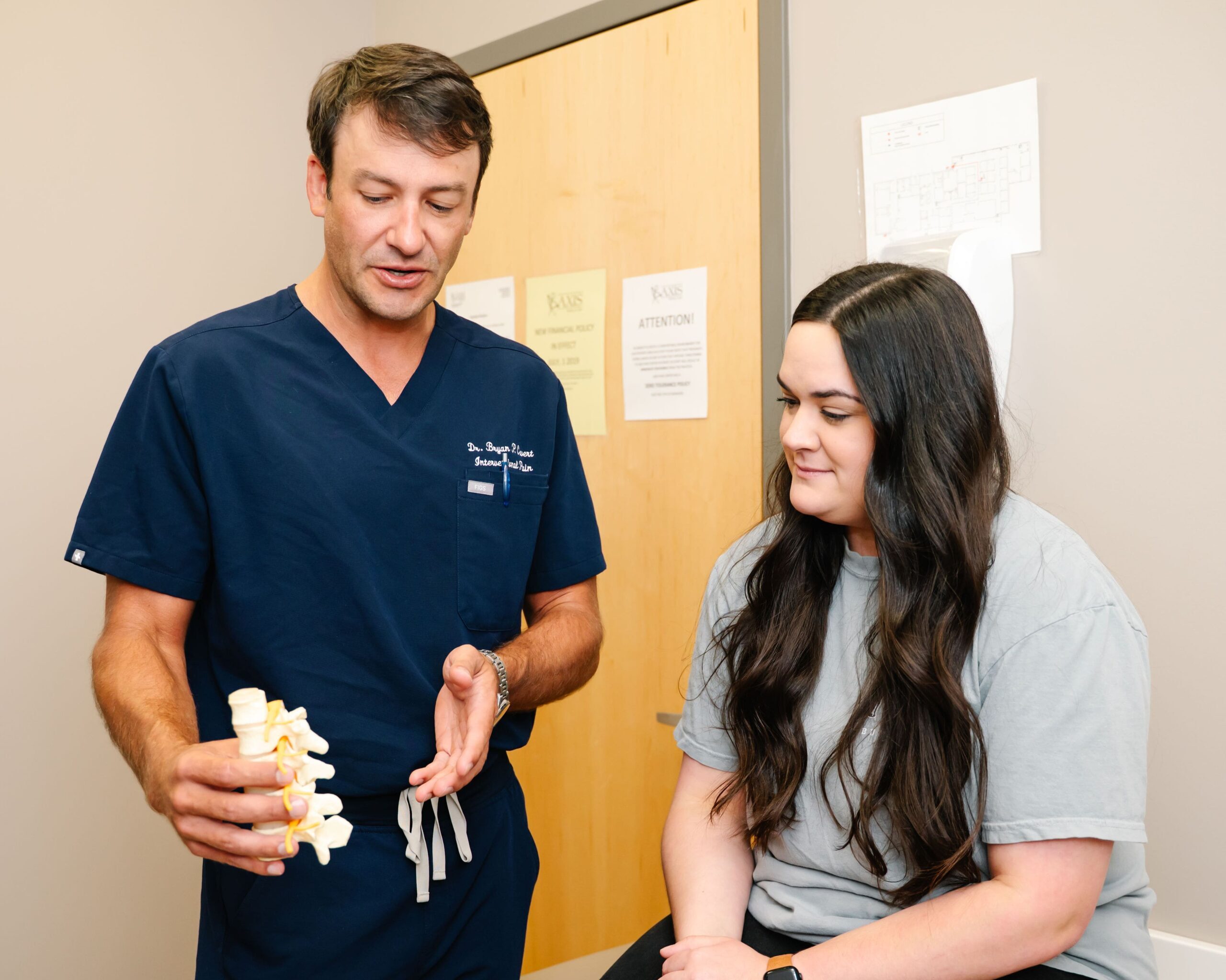 A close-up image showing a patient receiving a spinal injection, with the focus on the spine area, and soft lighting to emphasize comfort and care.