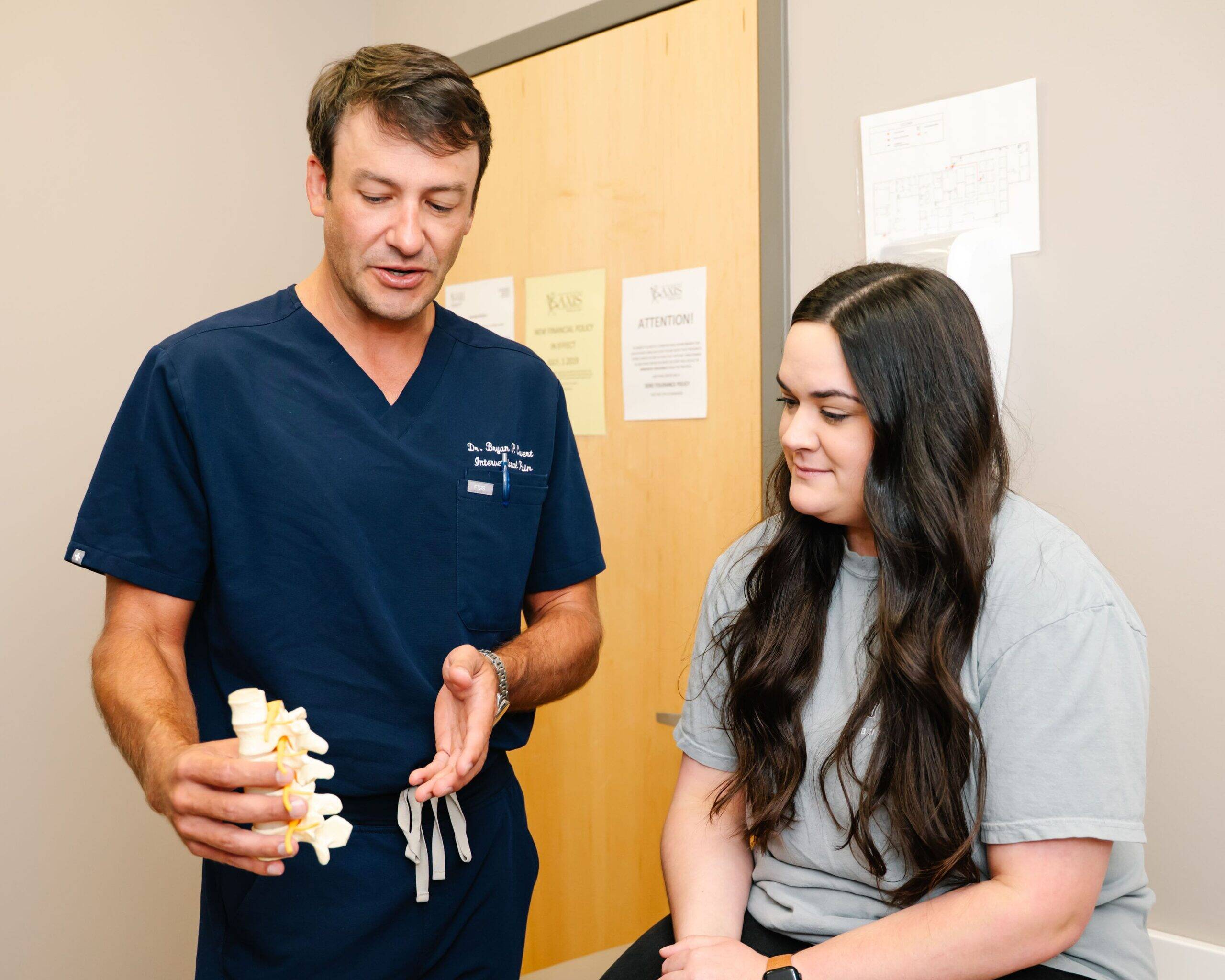 A close-up image showing a patient receiving a spinal injection, with the focus on the spine area, and soft lighting to emphasize comfort and care.